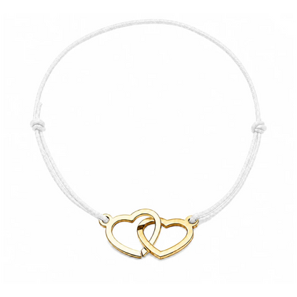 Bracelet cœur en acier doré avec cordon blanc ajustable, bijou personnalisable élégant fabriqué en France par Les Inséparables.