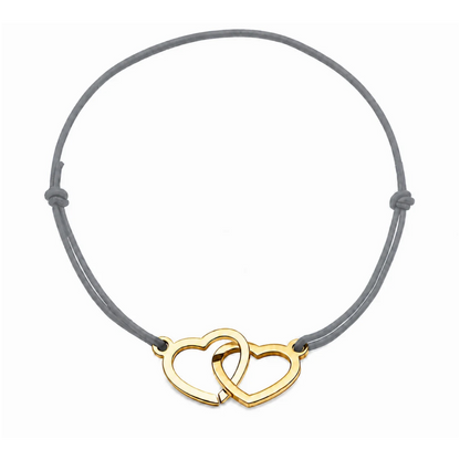 Bracelet cœur en acier doré avec cordon gris ajustable, bijou personnalisable élégant fabriqué en France par Les Inséparables.