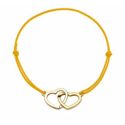 Bracelet cœur en acier doré avec cordon jaune ajustable, bijou personnalisable élégant fabriqué en France par Les Inséparables.