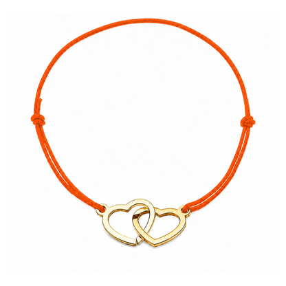 Bracelet cœur en acier doré avec cordon orange ajustable, bijou personnalisable élégant fabriqué en France par Les Inséparables.