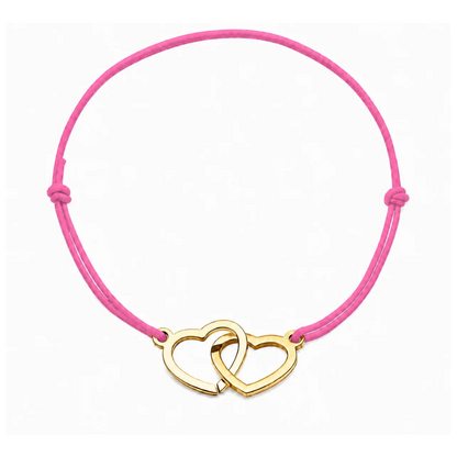 Bracelet cœur en acier doré avec cordon rose clair ajustable, bijou personnalisable élégant fabriqué en France par Les Inséparables.