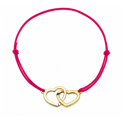 Bracelet cœur en acier doré avec cordon rose framboise ajustable, bijou personnalisable élégant fabriqué en France par Les Inséparables.