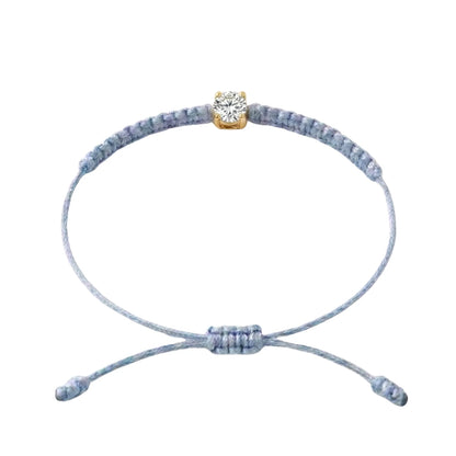 Bracelet cordon bleu gris, pierre de diamant de laboratoire sertie sur or
750/1000, fermoir coulissant réglable
