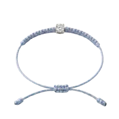 Bracelet cordon bleu ciel, pierre de diamant de laboratoire sertie sur or
750/1000, fermoir coulissant réglable
