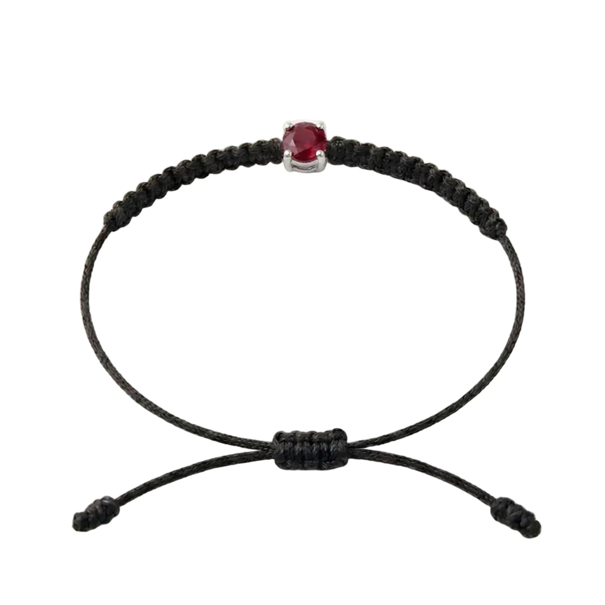 Bracelet cordon noir, pierre de rubis rouge de laboratoire sertie sur or 750/1000,
fermoir coulissant réglable