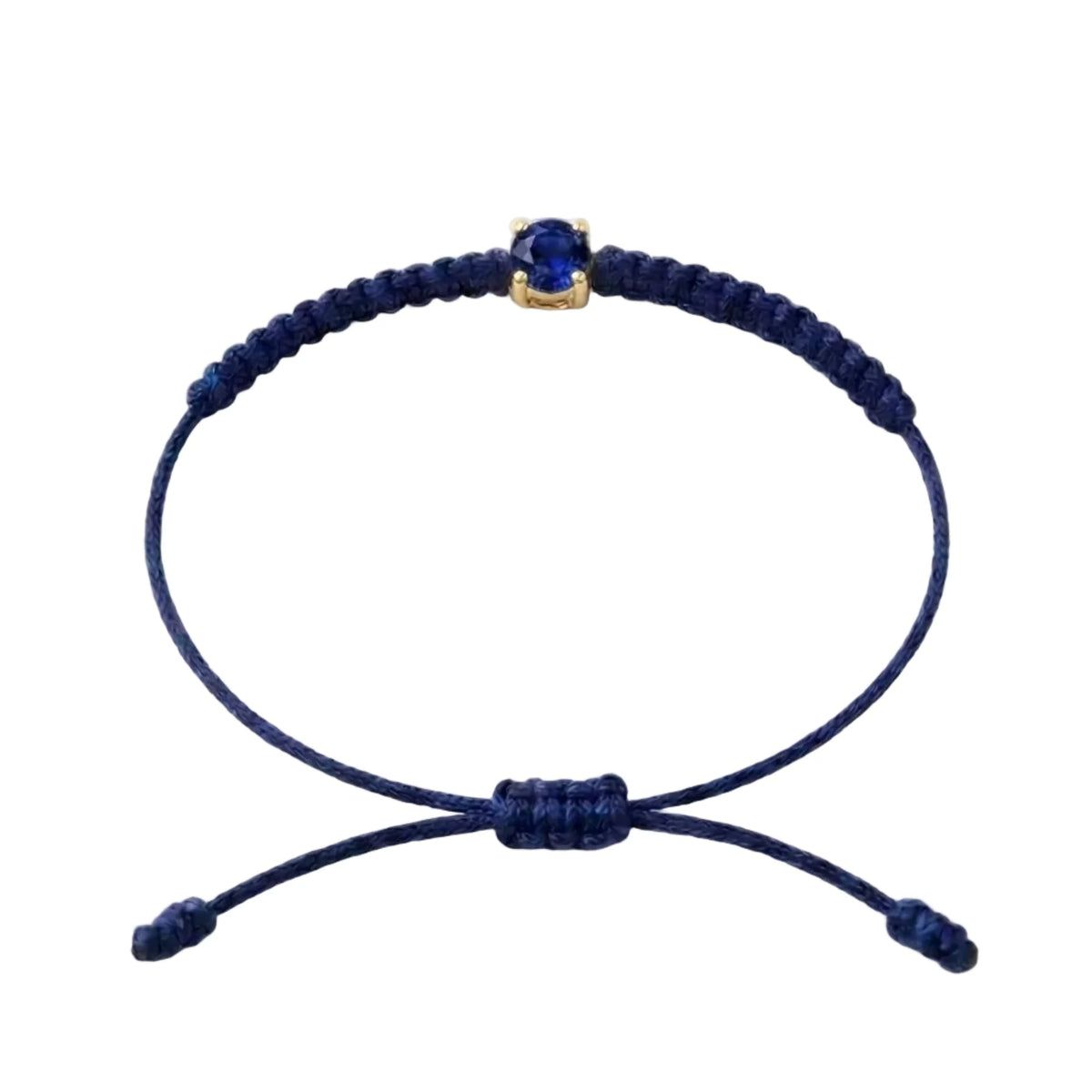 Bracelet cordon bleu marine, pierre de saphir bleu de laboratoire sertie sur or
750/1000, fermoir coulissant réglable
