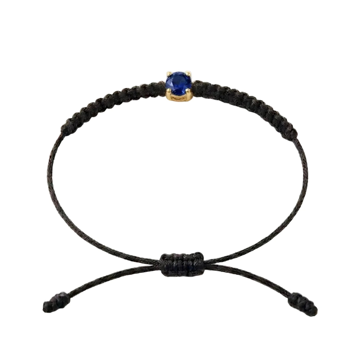 Bracelet cordon noir, pierre de saphir bleu de laboratoire sertie sur or 750/1000,
fermoir coulissant réglable
