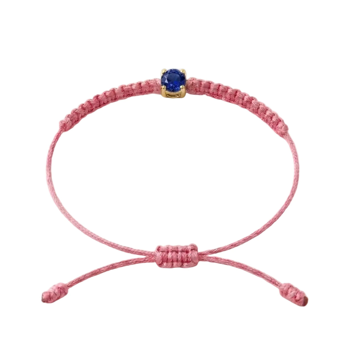 Bracelet cordon rose, pierre de saphir bleu de laboratoire sertie sur or 750/1000,
fermoir coulissant réglable
