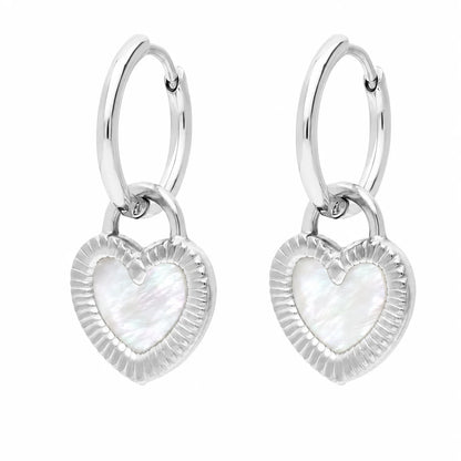 Boucles d’oreilles créoles réversibles argentées en acier inoxydable – côté cœur blanc